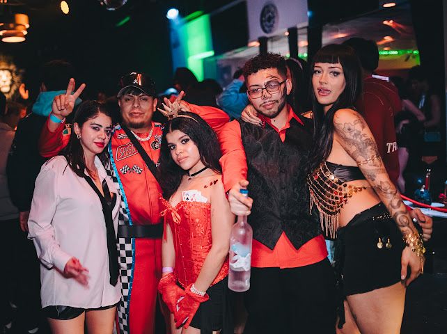 Group in costume with bottle service